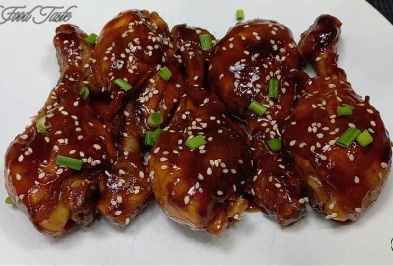 sticky chicken drumsticks in the serving dish