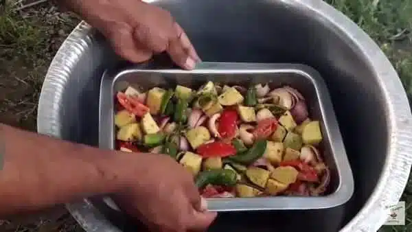 place the dish of veggies on the spacer