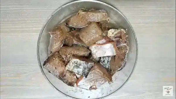 apply the mixture evenly to the fish cuts