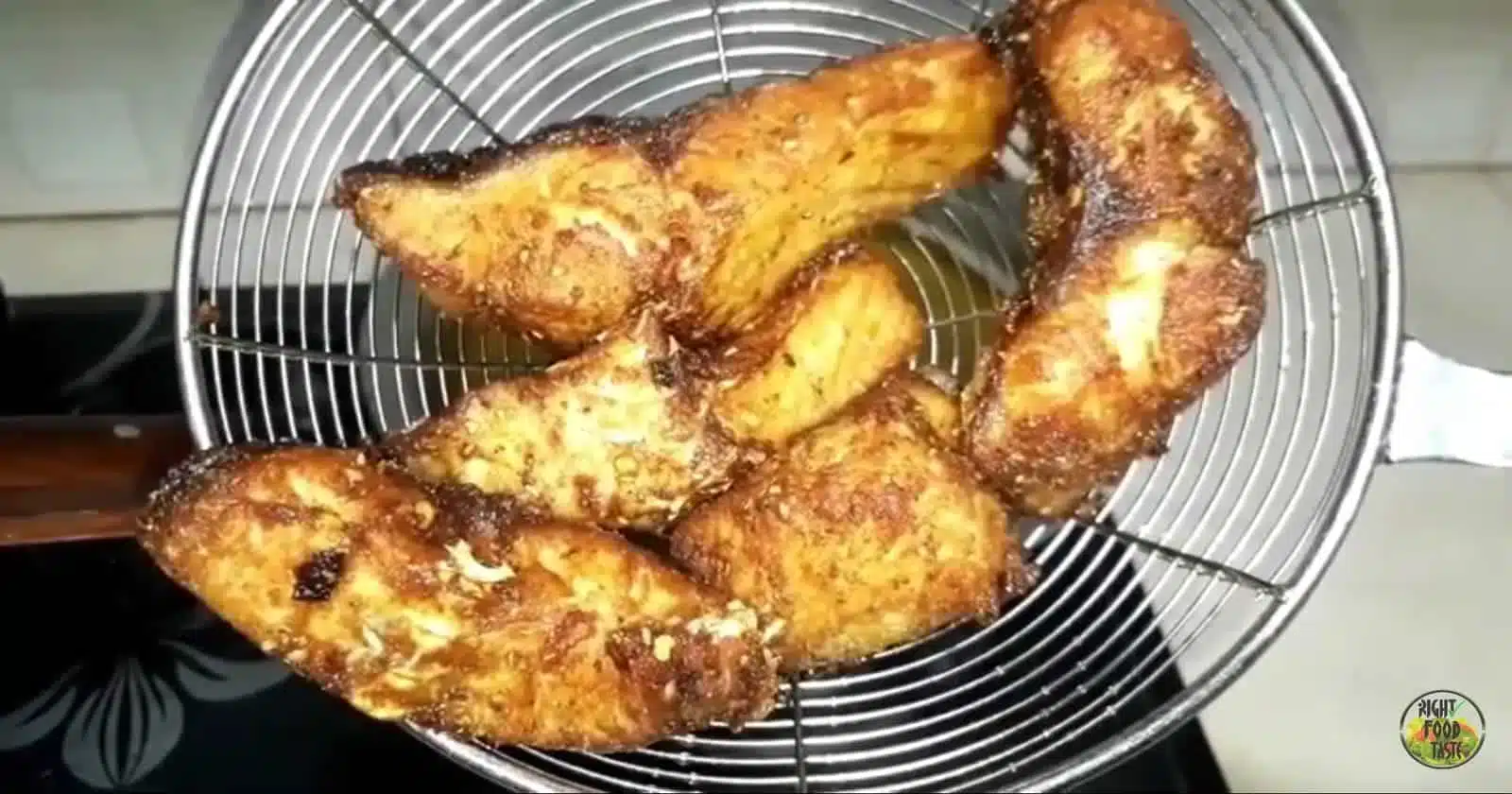 Crispy golden fried fish served hot with lemon wedges