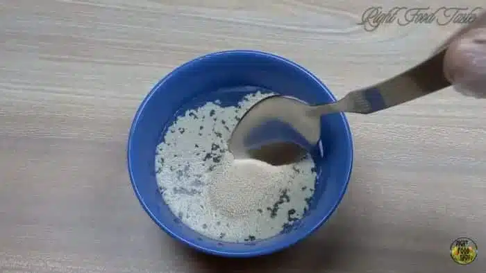 add sugar and yeast to lukewarm water
