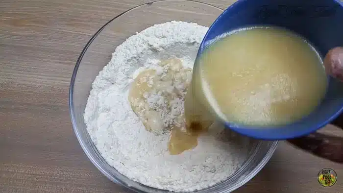 pour the mixture into the flour