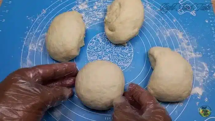 shape the pizza dough portions into smooth balls