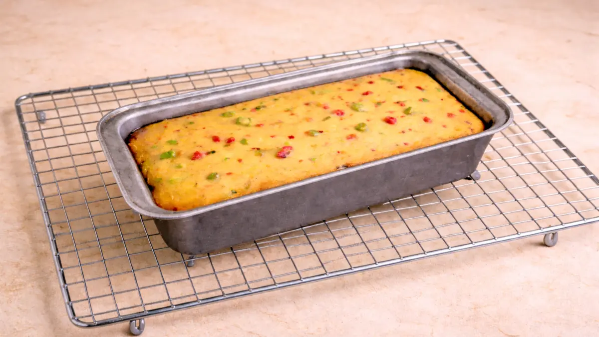 Freshly baked cake cooling on a wire rack after stovetop baking