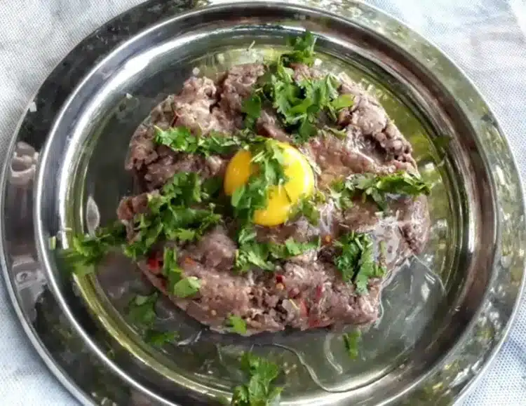 mixing of an egg into chapli kabab masala