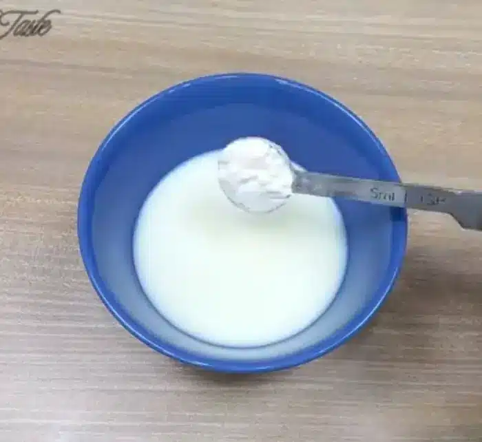 in a mixing bowl, mix corn flour in milk