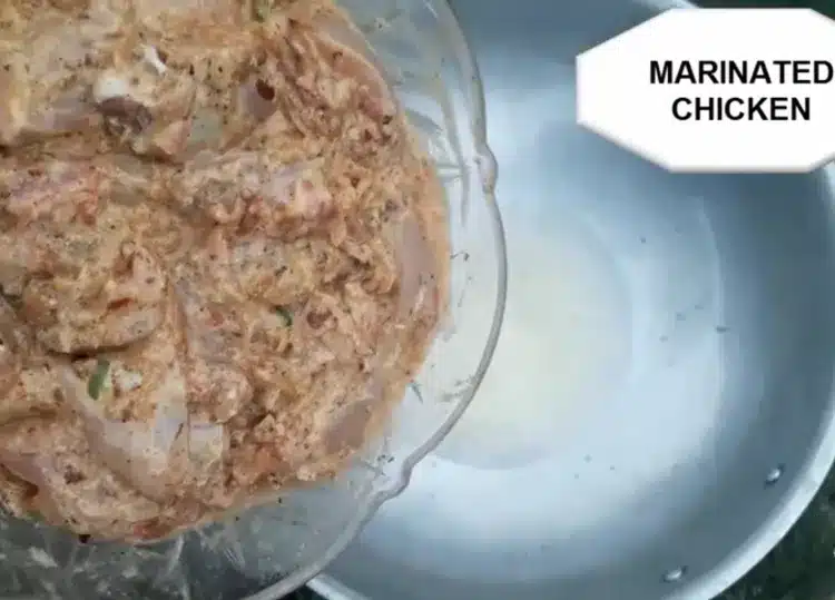 putting the marinated chicken into the karahi