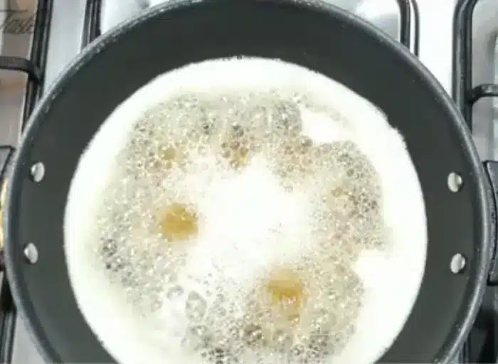 deep frying the chicken cubes in a frying pan