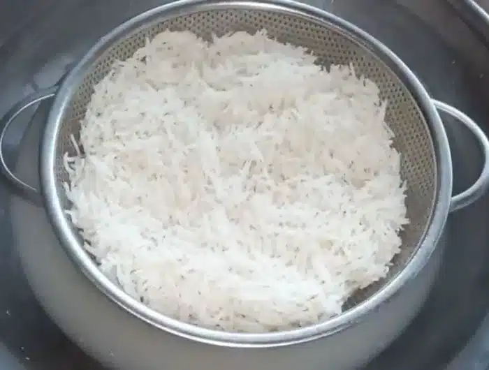 drain the water from the rice through a strainer