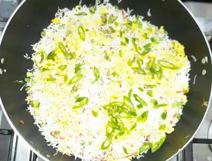 add fried eggs, fresh green sliced chilies, and the green part of fresh green onion