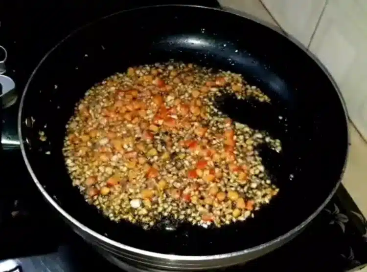 Sautéing ginger-garlic paste, onions, and tomatoes