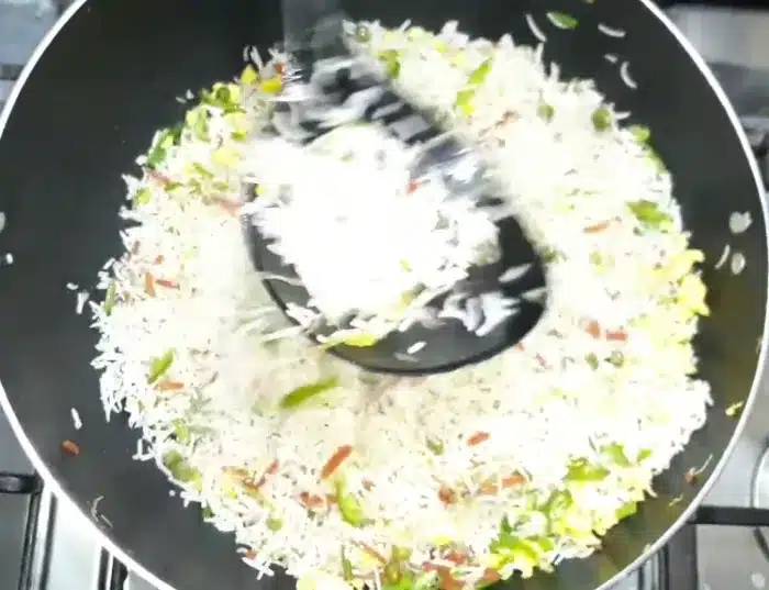add cooked rice and mix with the veggies