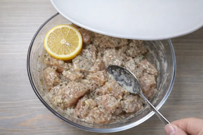 Marinated chicken covered and ready to refrigerate for 30 minutes
