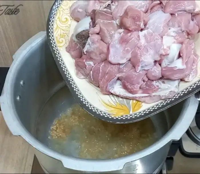 sautéing the ginger-garlic paste until light brown color and then adding beef