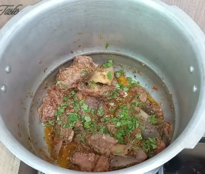 adding the final touch of freshness with finely chopped coriander leaves