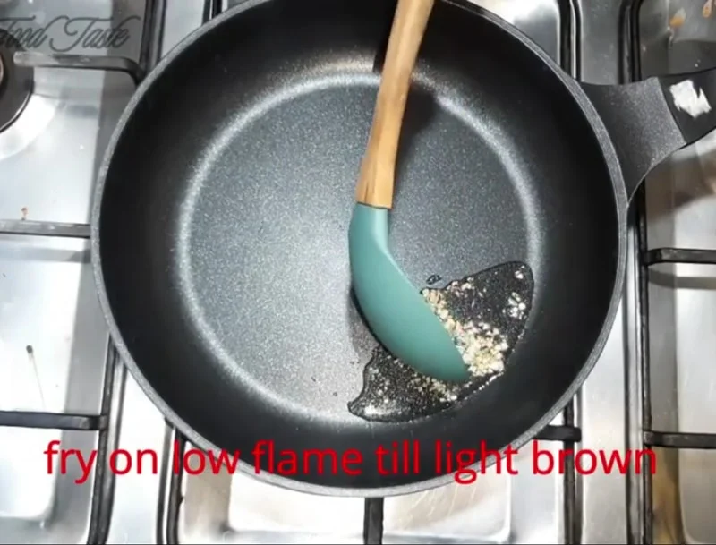 Garlic paste lightly sautéed in oil for orange vegetable sauce