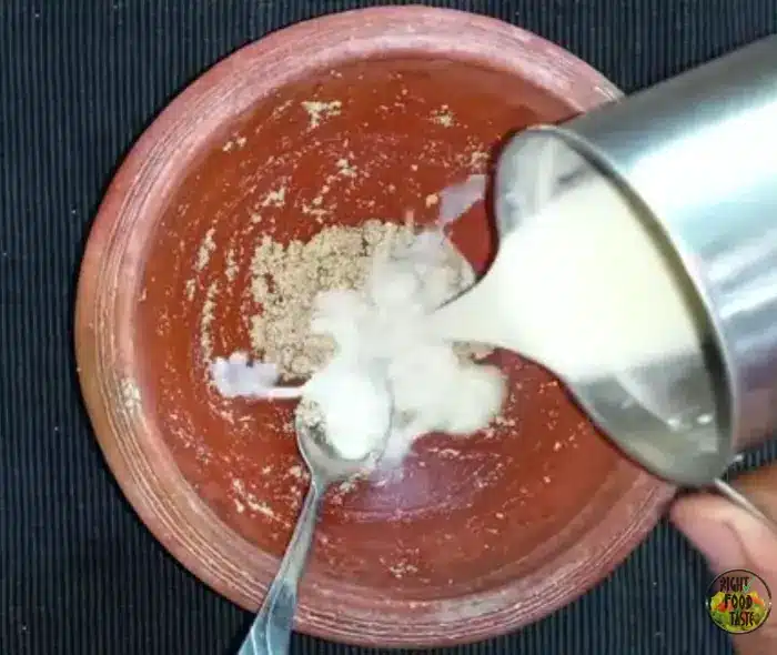 mixing the thandai masala with milk
